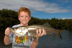 Boy holding snook